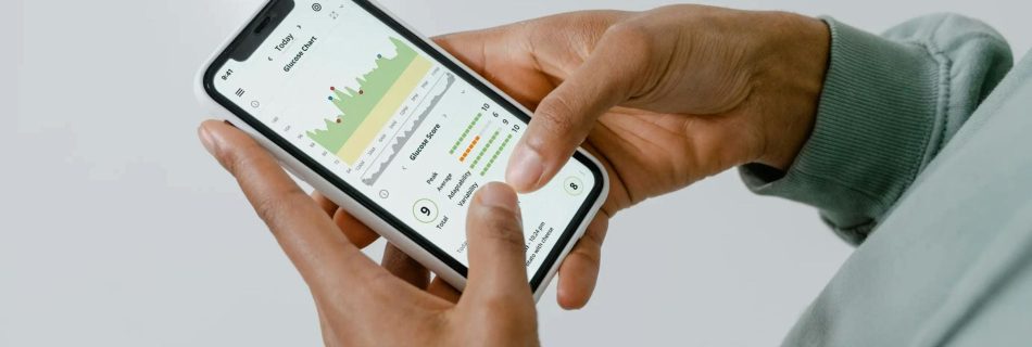 Hands holding a phone with a trading app.